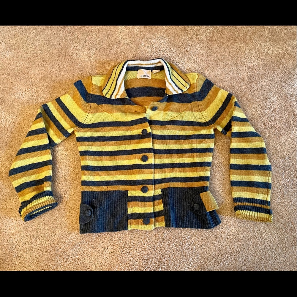 Lambswool long sleeve designer sweater with matching covered buttons.